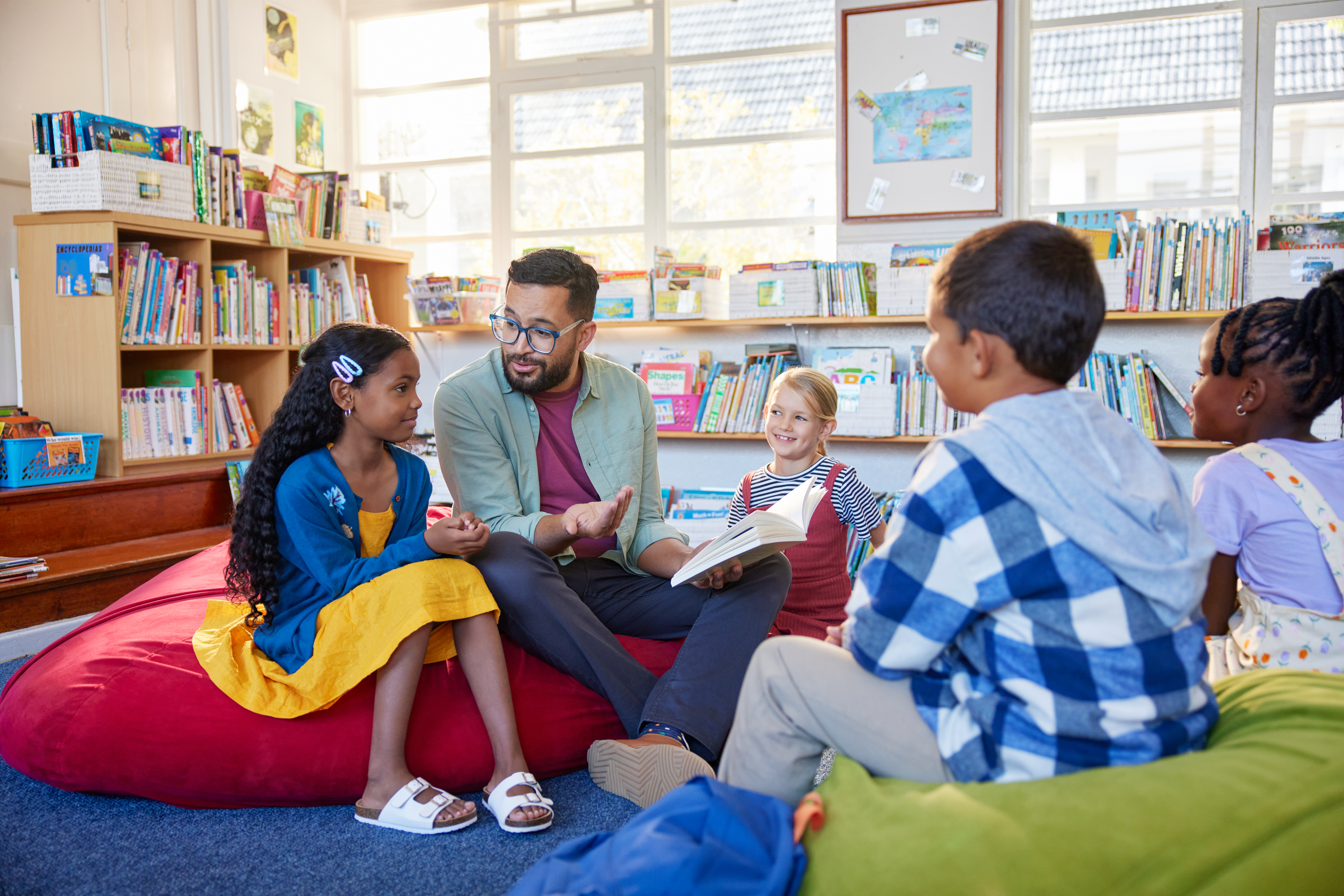 Librarian reading to a group of children during storytime